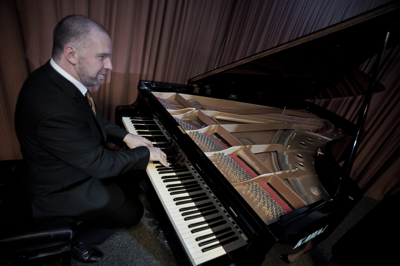 Dr Mark Baynes at the Kawai grand during a doctoral recital